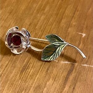Avon brand red rhinestone brooch on silver tone pale green leaves 1 3/4” down
